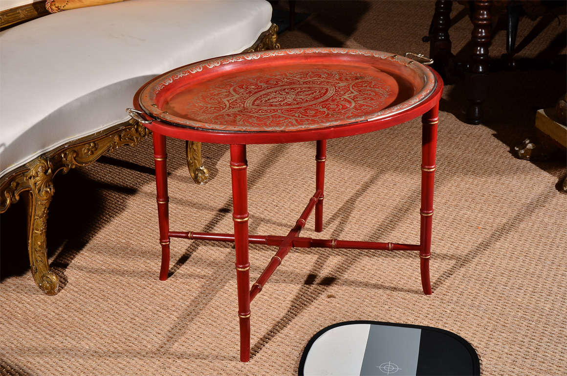 This French 19th Century Chinoiserie Tray is painted in such a vibrant red! The base has been built new for the top, reflecting a bamboo style. A perfect small scale cocktail table, the removable tray makes serving your favorite beverages easy.