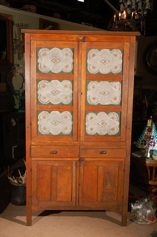 C. 1900 American made wood and painted punched tin pie safe. Soulful old piece made by ACME in Chattanooga, Tennessee (image #4). Has one shelf in the top area, two middle drawers, and a large storage area below. There are grooves for more shelves.