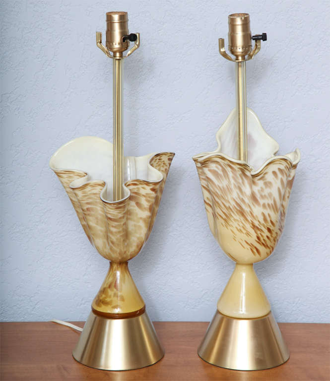 Unusual and rare pair of free-form handkerchief shaped Murano glass lamps in pale yellow-gold with white casing and sparkling aventurine spots. Brushed, solid- brass bases. (Shades not included.) Height measurement to top of socket.