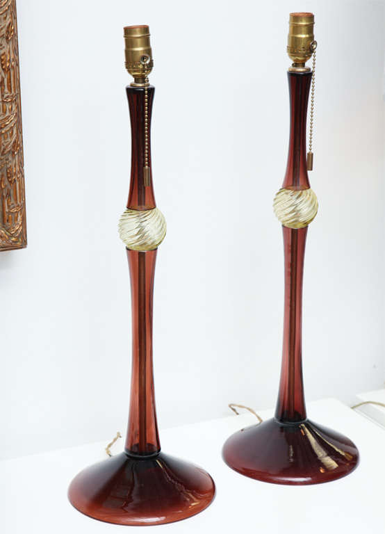 BEAUTIFUL PAIR OF  LAMPS DESIGNED BY THE LATE JOHN HUTTON FOR DONGHIA. THESE WERE MADE IN ITALY IN THE 80,S.THEY ARE BOTH SIGNED JOHN HUTTON.THESE MURANO LAMPS WERE PRODUCED BY SEGUSO FOR DONGHIA IN THE 1980,S.THEY ARE SIMPLE YET CHIC.LIKE MOST OF