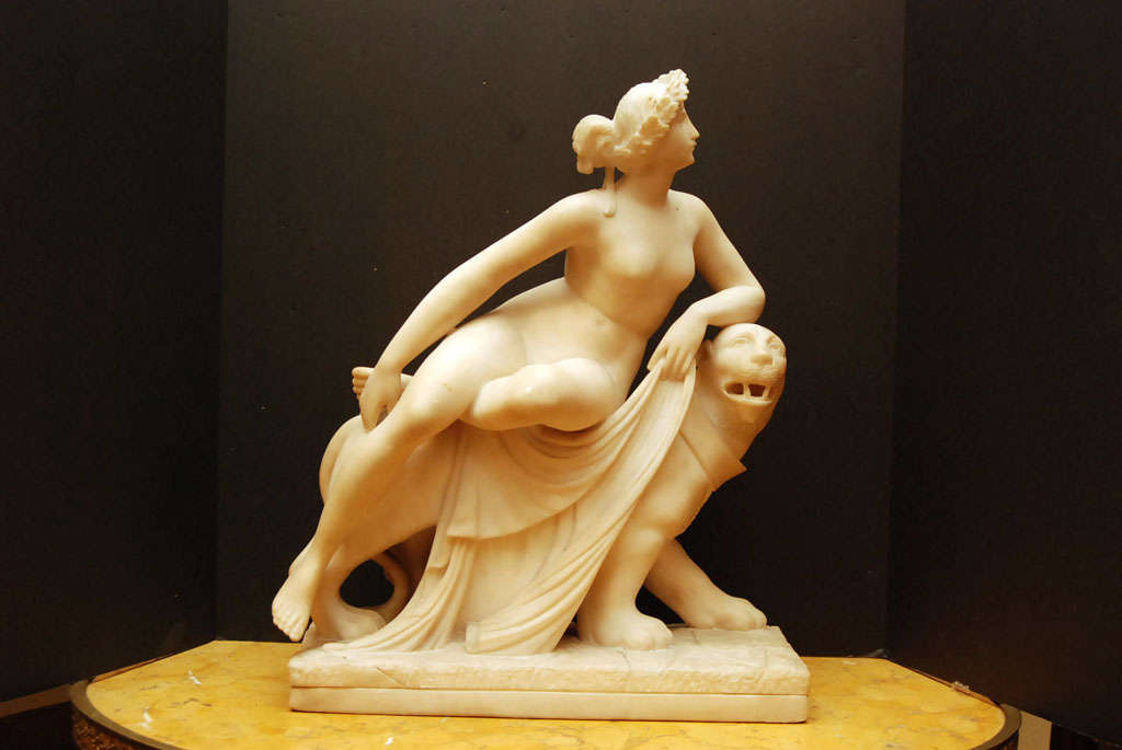 A finely carved and finished alabaster grand tour copy of the classical statue of the Cretan princess Ariadne, wife of the god of wine Dionysus and mistress of the Labyrinth seated on the big cat in a relaxed pose .   von Dannecker was appointed