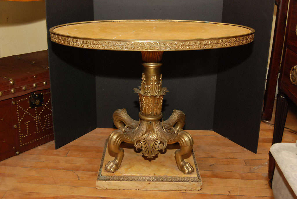 This very fine gilt bronze and sienna marble coffee table made in France has all the qualities associated with the work of Jansen who produced specialty furniture in ancient styles for their discriminating clientele. The bronze casting is excellent