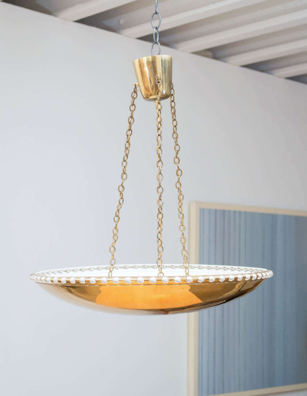 A brass bowl chandelier rimmed with small glass balls and suspended with three brass chains. Design and Manufacture by J T Kalmar .