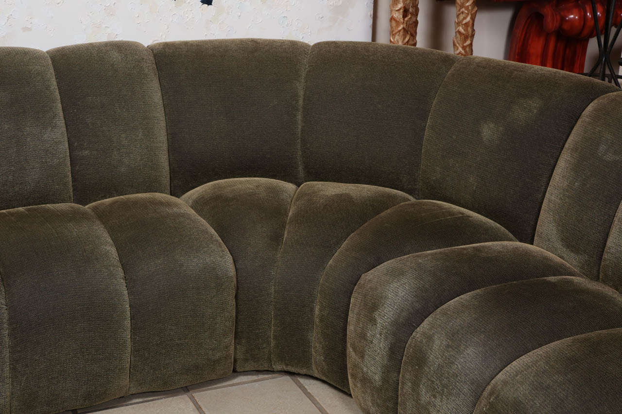 Beautiful corner sofa in three sections by Steve Chase.   Upholstered in a subtle mossy green miniature herringbone fabric.