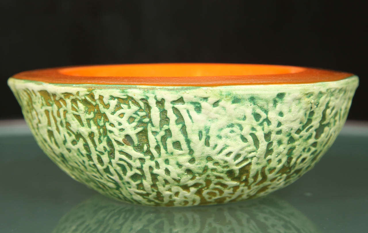 Six  glazed ceramic bowls in the remarkably realistic form of cantaloupe halves by Ed Langbein