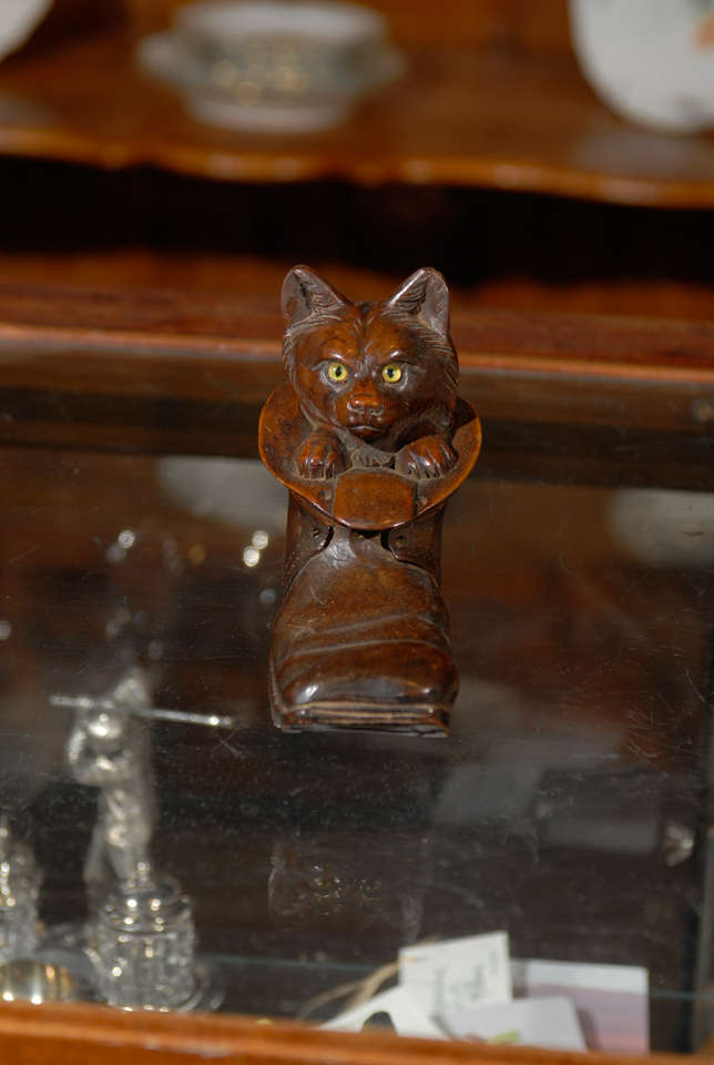 A German Black Forest carved wood cat in boot inkwell from the early 20th century. Whether this Black Forest piece was inspired by Charles Perrault's 17th century version of the 'Chat Botté' or not, this German inkwell will charm you with its