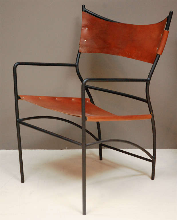 Pair mid-century iron and custom leather chairs.  New leather slings.