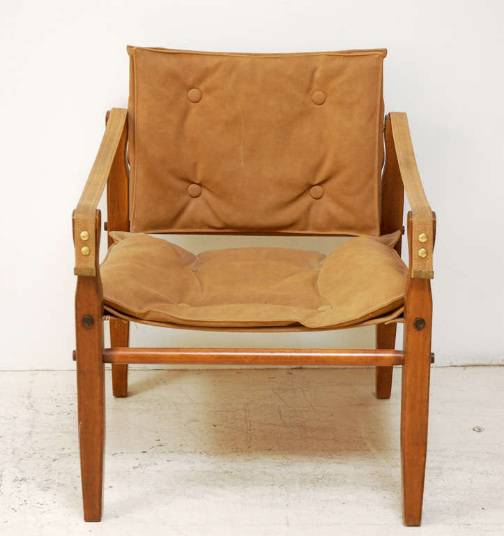 Pair of suede and wood campaign chairs for Glenn of California with matching ottoman (23.5x15.5x24