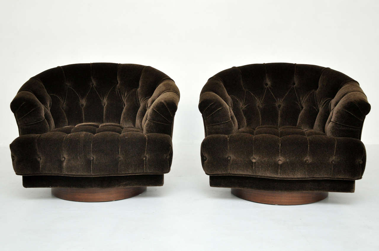 Swivel lounge chairs designed by Edward Wormley for Dunbar.  Tufted seats in chocolate mohair.