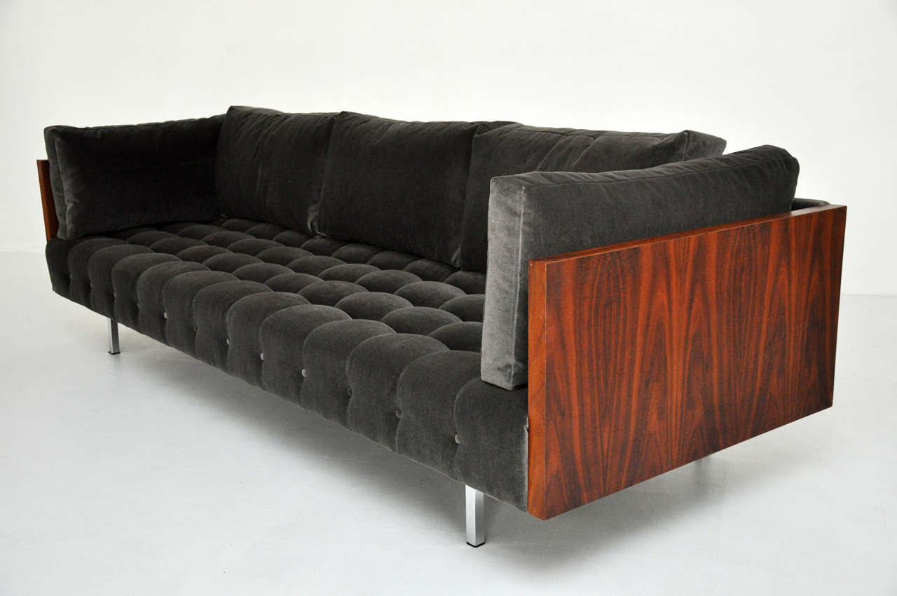 Sofa designed by Milo Baughman for Thayer-Coggin.  Figural walnut sides with new velvet upholstery.  Biscuit tufted seat with down filled back and side cushions.