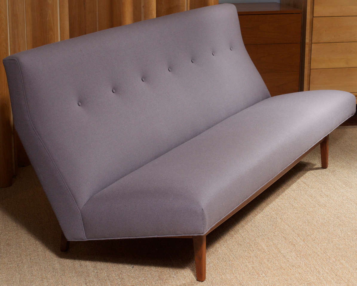 Jens Risom design angular sofa on a floating walnut frame, completely restored.