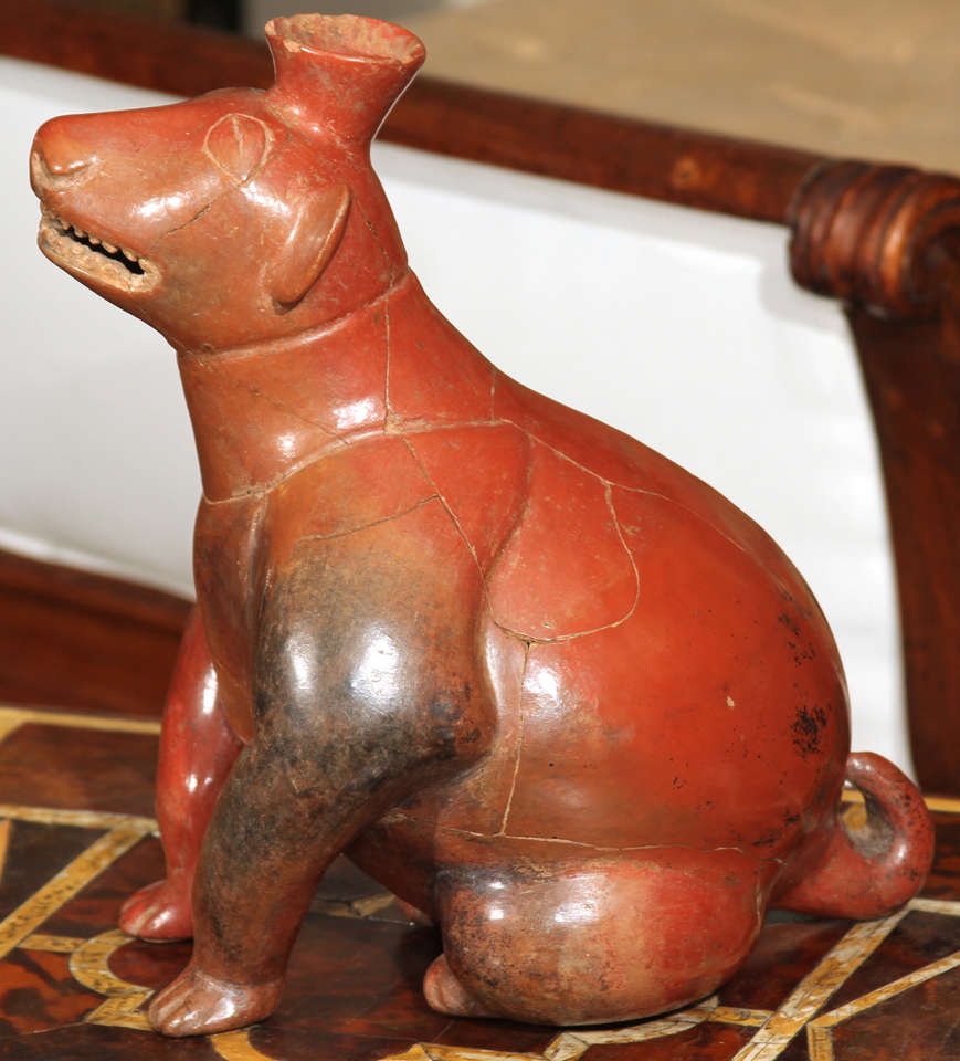 A charming hand made terracotta pre-Columbian style figure probably of a dog.