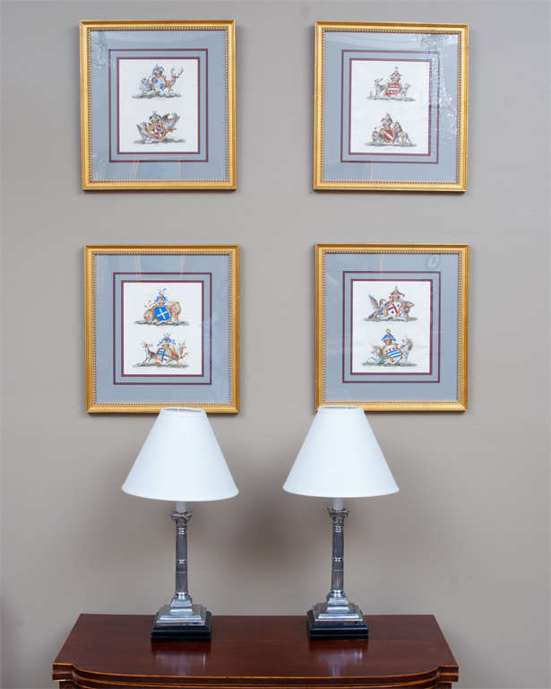 These hand colored engravings are of coats of arms of prominent British families -- museum matting and framing done in the last 20 years.