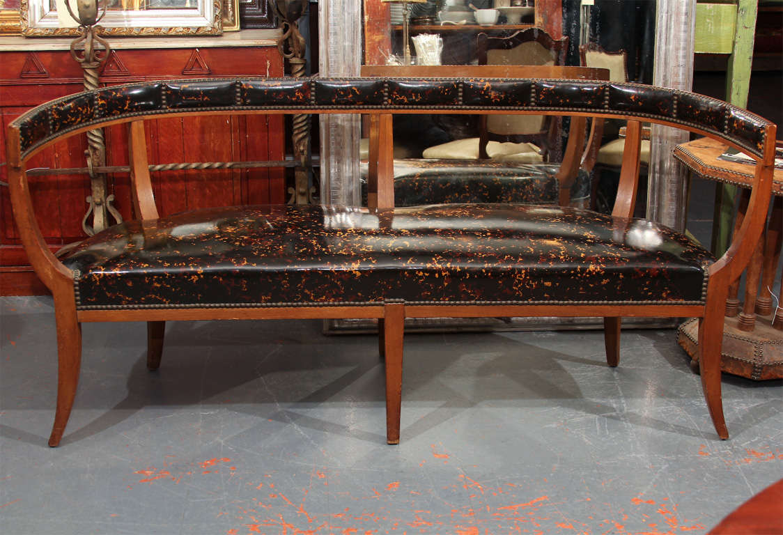 knock out bench of faux tortoise trimmed in nailhead. 