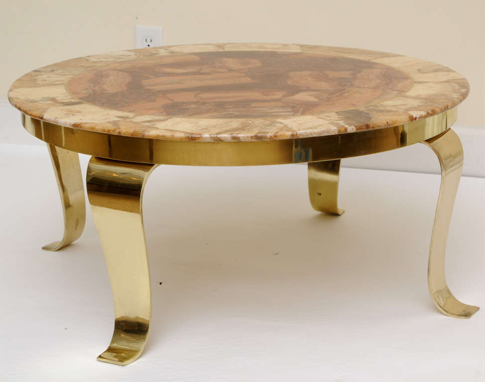 This signed onyx marble and polished brass cocktail/ side table resembles beautiful earthy agate. This was made in Mexico in the 60's and is signed on the front of the table and has 