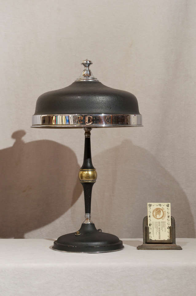 This very high quality deco lamp represents some of the nicest art deco features.  Great design, including the chrome and crinkle black finish.  Even the sockets are all chrome.  The lamp has an iron weight and is quite heavy; will not be knocked