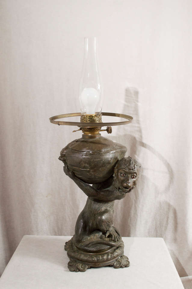 Patinated Kerosene Lamp with Monkey and Coconut