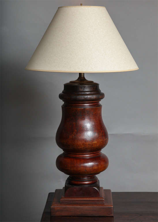 Bold and well patinated 19th century English mahogany turnings, now as lamps, crisply turned from single blocks of figured timber.