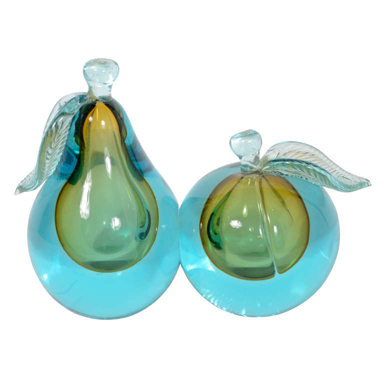 Teal, Amber and Clear Hand Blown Murano Glass Pear and Peach with 24k Gold flecks on the stem and leaves. Stunning decorative pieces with a solid weight and beautiful clarity. 

Pear Measurement: 7.5