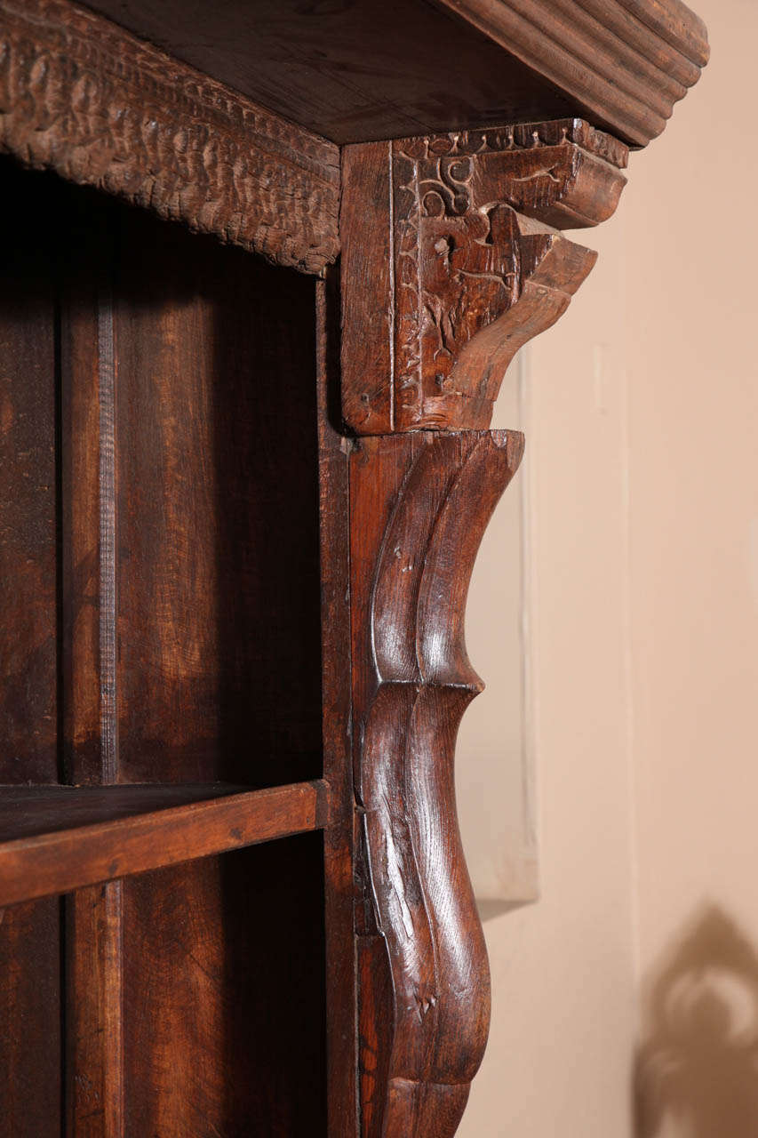 carved wood bookcase