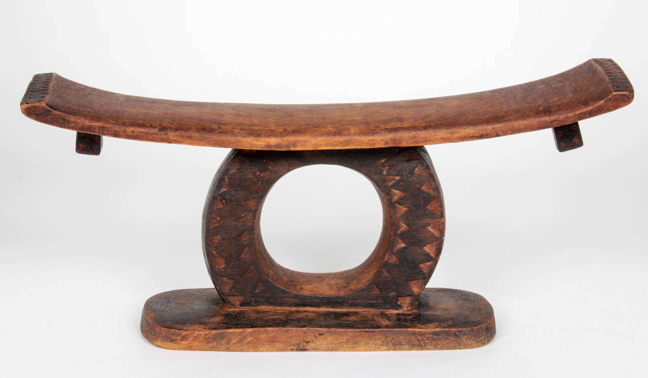 SOUTH AFRICA - ZULU TRIBE

Head rest  - early to mid 20th Century

Geometric carved wood with rich natural patina 

Headrests are used by both men and women while resting or sleeping. It is popularly believed that the headrest serves a