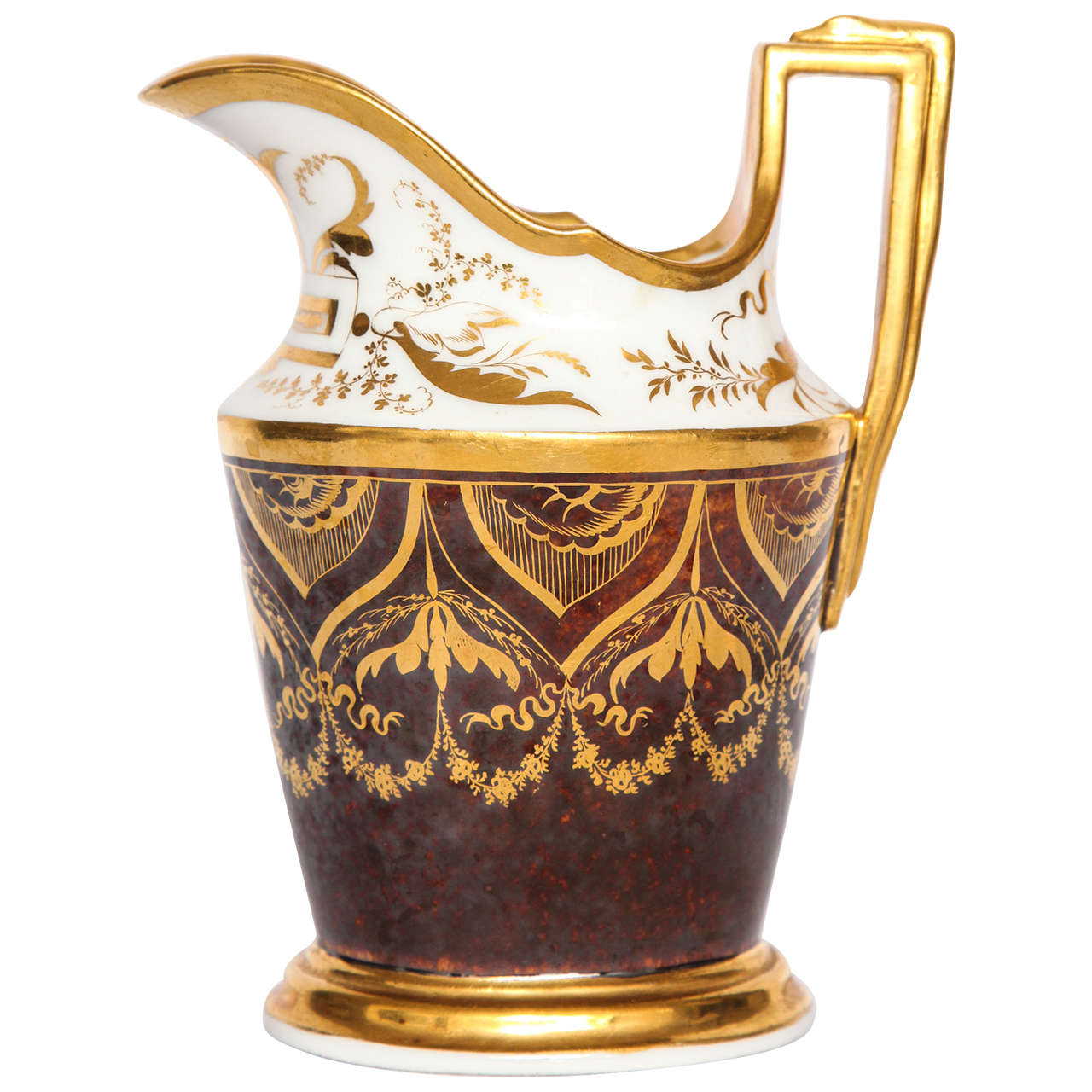 French gilt and painted porcelain pitcher. Fine Empire period gilt painted milk pitcher with rich mocha brown ground and neoclassical gilt garlands and floral swags. Markings for Darte Frères Paris. France, circa 1810. 
Dimensions: 6.75
