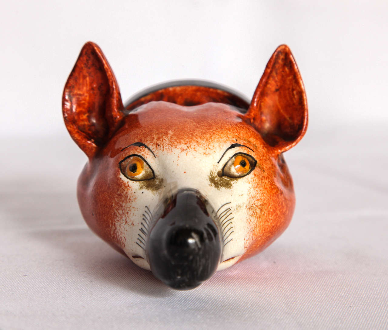 Antique English porcelain stirrup cup in the form of a red fox head. 
Dimension: 2.5