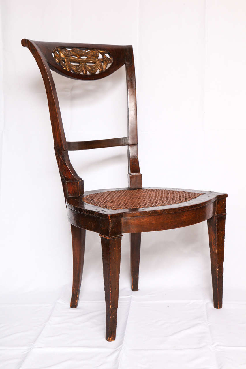 Antique mahogany and carved giltwood neoclassical swan-motif occasional side chair with caned seat. Italy, early 19th century. 
Overall 33