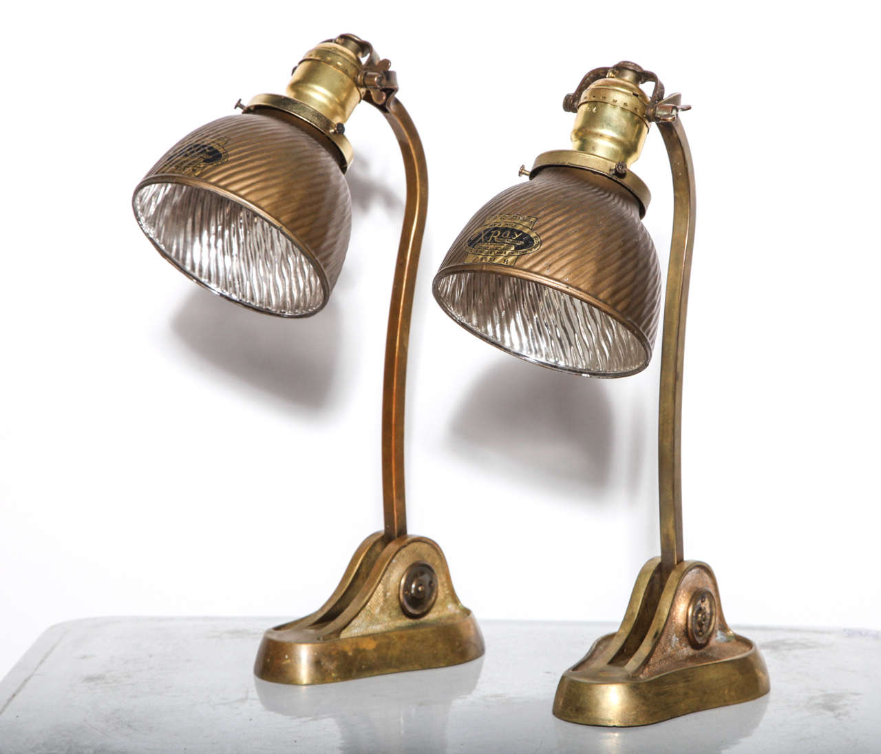2 heavy adjustable Art Nouveau Bronze Sconces, Work Lights, Desk Lamps or small Table Lamps.  Keyhole shaped textured bases, adjustable curved swing arms, with a pair of adjustable period XRay Mercury Glass Shades.  Shade exterior: Gold. Shade
