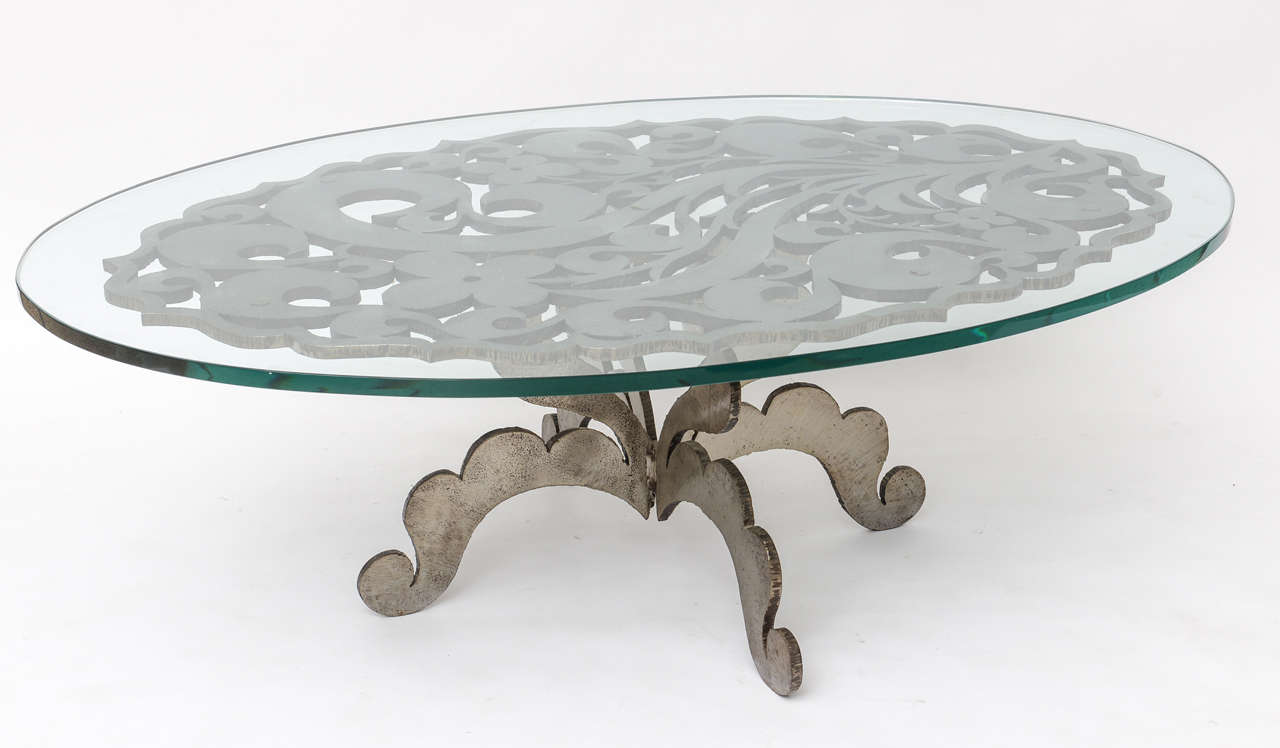 We love the wry Brutalist-style of this glass-topped coffee table with flowers and scrolled flourishes executed in rough, torch-cut steel. Artist signed (illegibly), 2 in an edition of 15, dated 1970. We'd use it indoors, or out, letting it age into