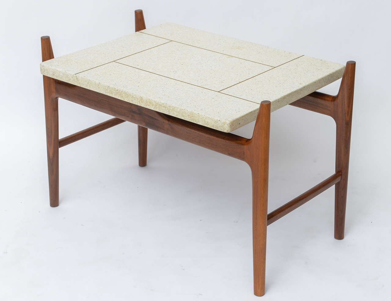 Nicely-scaled piece by Harvey Probber can serve as a generous end table or a European height coffee table. Rosewood base supports a brass inlaid, terrazzo top in neutral tones of cream and grey.