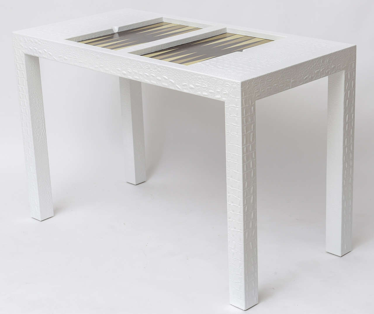 Backgammon table in white crocodile embossed leather. Designed by Karl Springer.