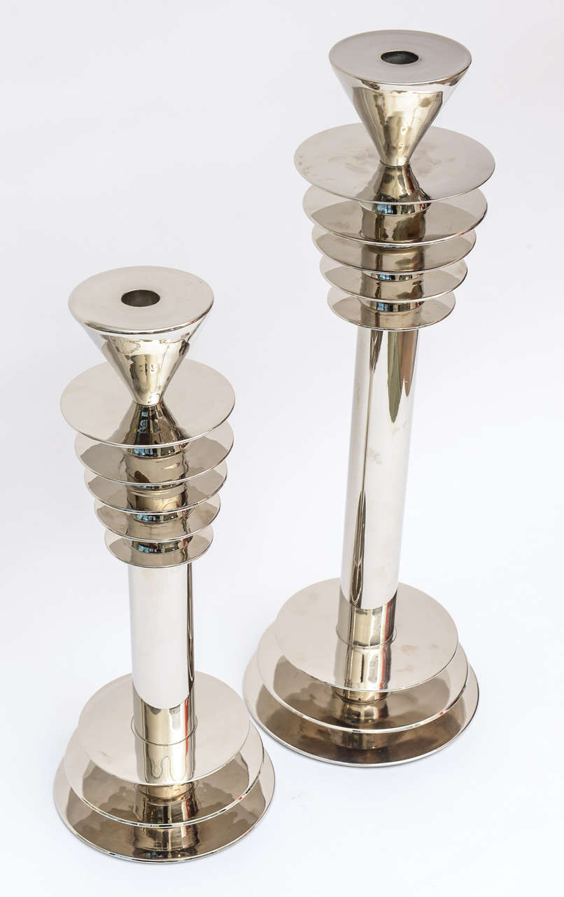 These fantastic and very heavy nickel silver over white bronze machine age candlesticks are ultra large and ultra fabulous! They are two different sizes.
Incredibly well made from the time period. The rings or steps are 5 on the top and 3 on the