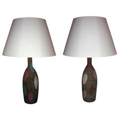 A pair of bottle-shaped ceramic lamps