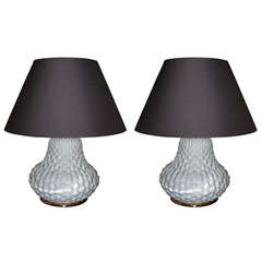 A pair of lotus-shaped white ceramic lamps