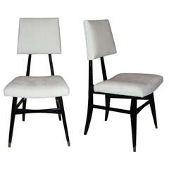 A pair of black-lacquered chairs by Raphael