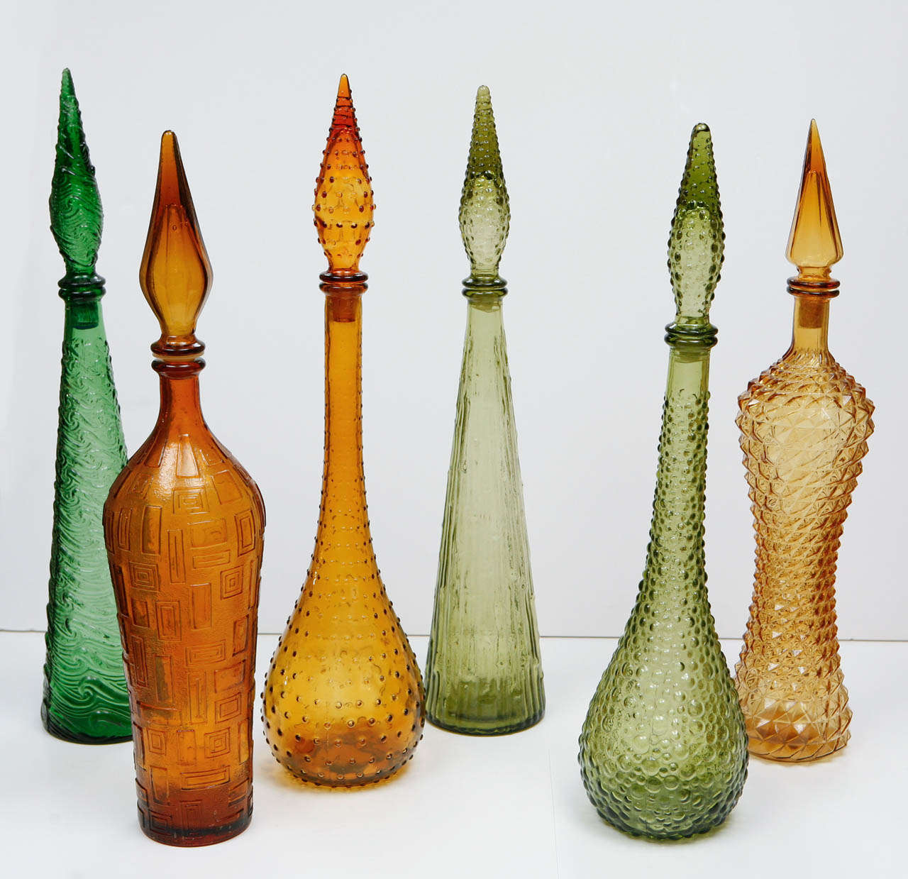 Murano bottles in assorted colors and shapes with stoppers. Various Sizes 