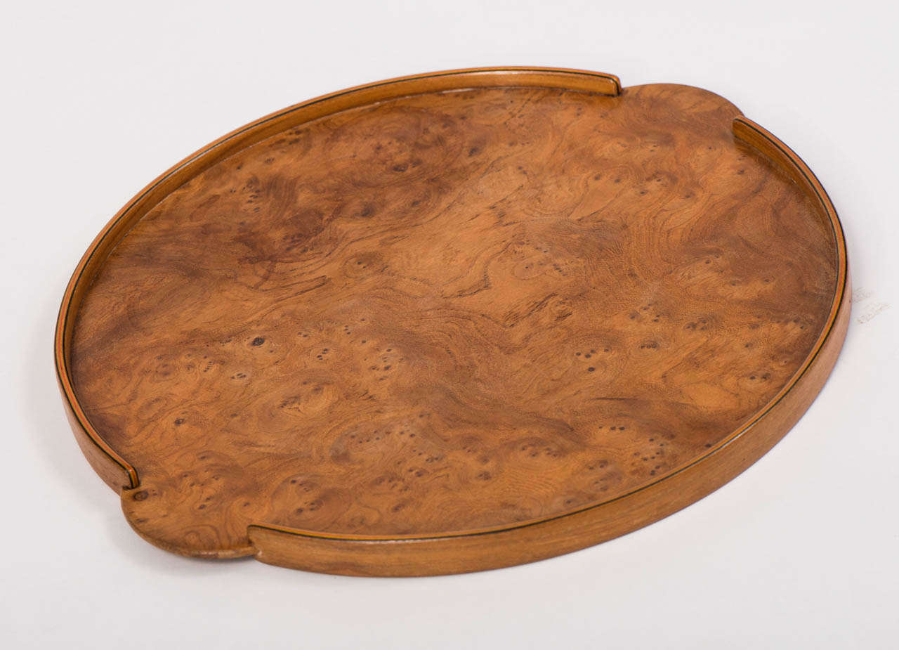 A Burr Elm drinks Tray by John Makepeace.
Of Circular form.
England circa 1970
Diam 33cms.
John Makepeace, OBE, (b.1939) IS ONE OF THE LEADING FURNITURE DESIGNERS OF THE PRESENT DAY. .
He bought Parnham House, Dorset in 1976 and founded the