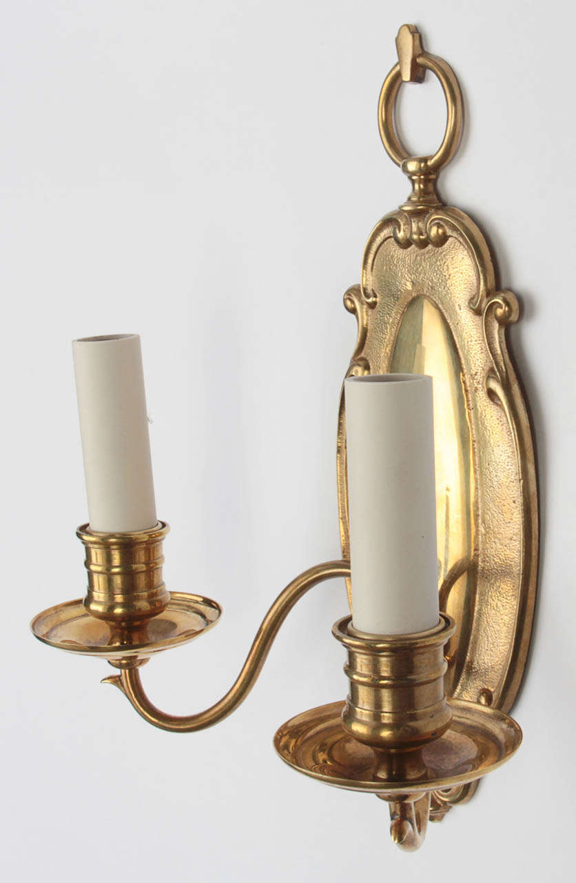 A Pair Of Cast Brass Sconces In Excellent Condition In New York, NY