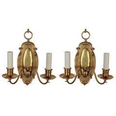 A Pair Of Cast Brass Sconces