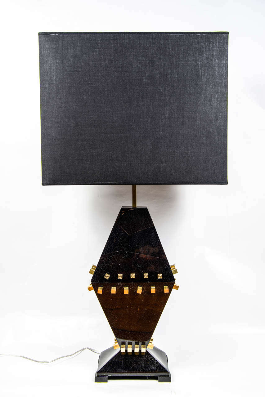 Nice pair of lamps made of black nacre and square brass spikes all around.

New electrification, perfect condition.