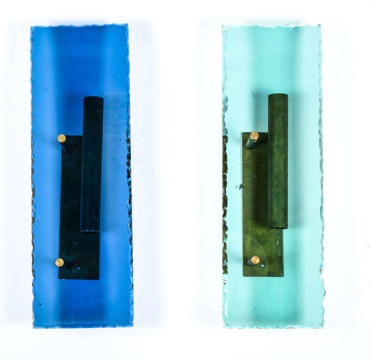 Pure set of eight wall sconces in the style of Fontana Arte in the 1950s.
Each sconce is a metal structure made for two bulbs behind a translucent roughly cut blue or green piece of glass.

Four of each color is available.

Perfect condition,