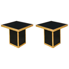 Pair of end tables with black mirror and gilded metal.