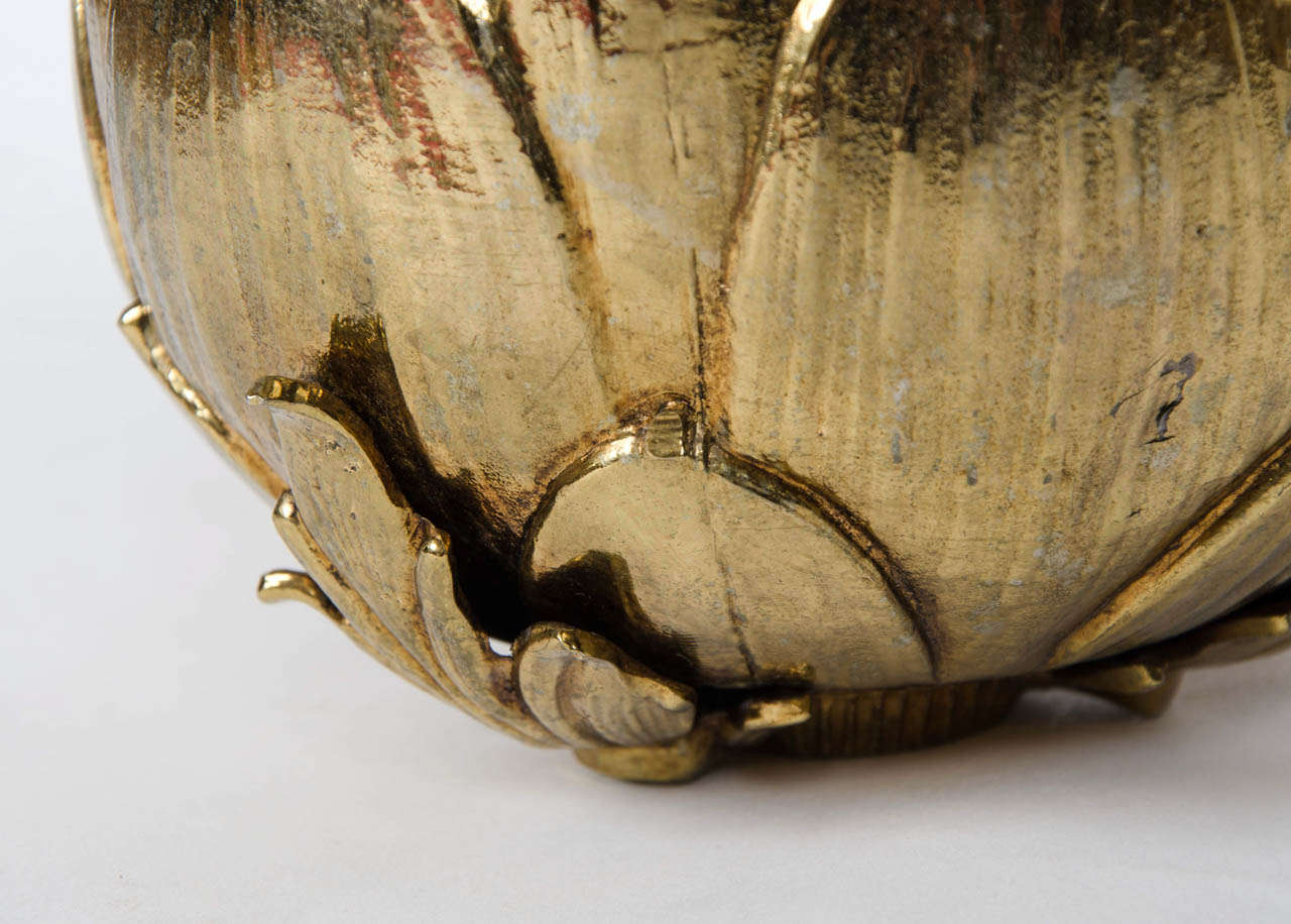 Wonderful handmade ice bucket in the form of a pale gold artichoke. Signed on base.