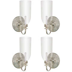 pair of mirrored sconces with glass globes