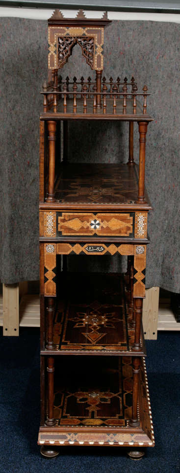 Architectural cabinet in Moorish style inlaid with coloured wood and bone.