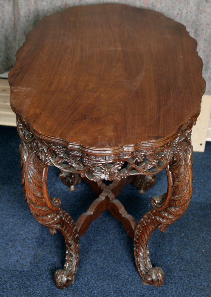 Anglo-Indian centre table with scrolling vine decoration. Bombay Presidency, 19th century.