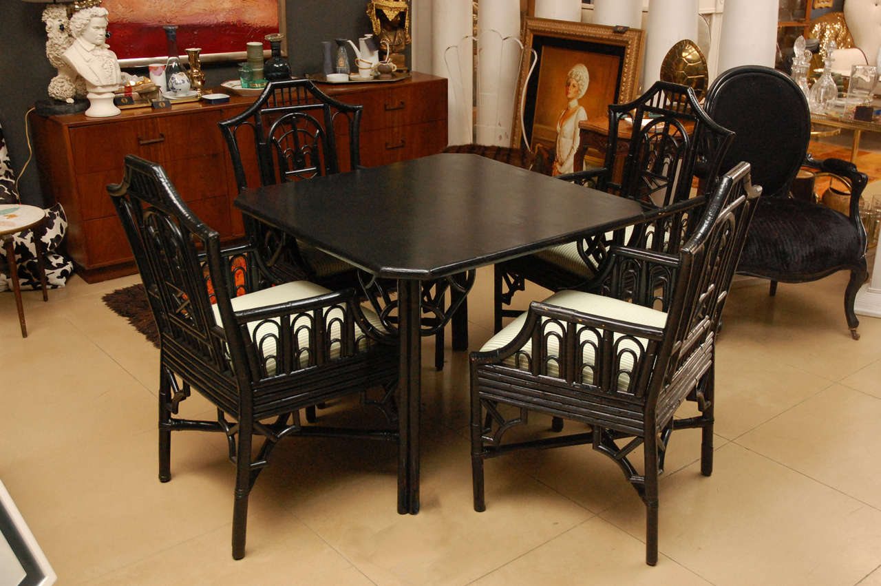 Black wood chinoiserie style faux bamboo square table and set of 4 matching arm chairs with upholstered seat cushions. 