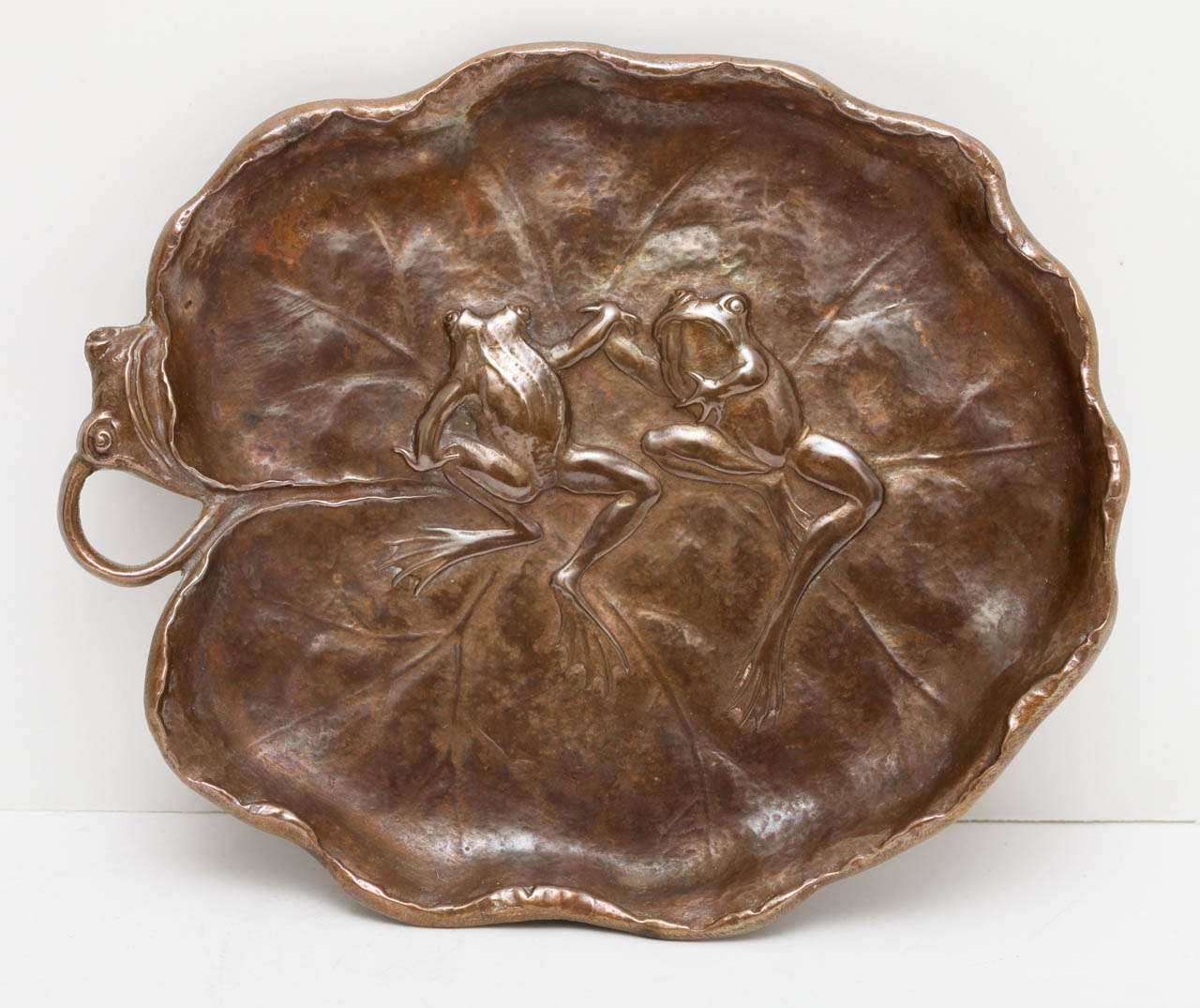 An exceptional turn of the century bronze tray by Gorham in the form of a lily pad. A very rare piece as Gorham didn't produce many bronze pieces, they were primarily known as silversmiths.  A bronze foundary casting which has wonderful detail. A