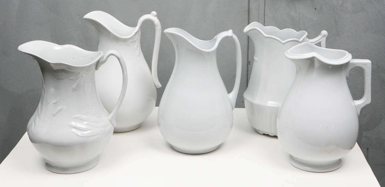 This assortment of White Ironstone pitchers provide a wonderful variety of attractive examples of this distinctive type of English & American china.  The pieces in this group are classically handsome with exceptional shapes and fine details that
